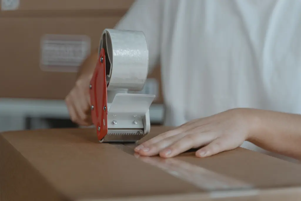 Courier loading parcels into an MMP delivery vehicle